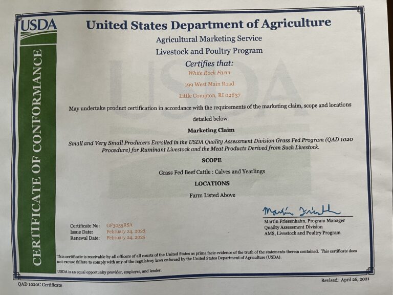 A photograph of a USDA Grass Fed certification.